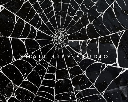 a spider web with the words small lil studio on it