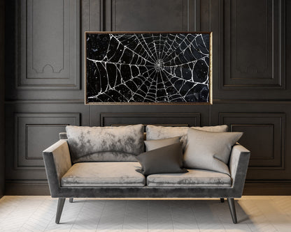 a living room with a couch and a painting on the wall