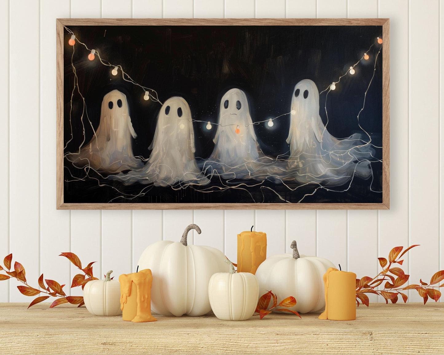 a painting of three white ghostes with pumpkins in front of them
