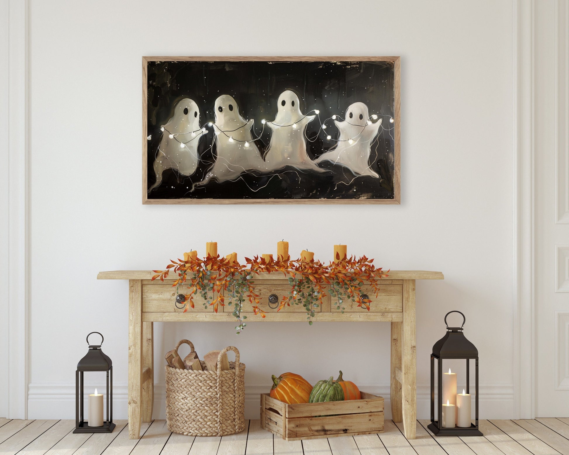 a painting of three ghost on a wall above a table